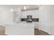 Modern kitchen with white cabinets and stainless steel appliances at 1680 Abberly Pl, Graham, NC 27253