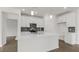 Modern kitchen with island, stainless steel appliances and gray hex tile backsplash at 1680 Abberly Pl, Graham, NC 27253