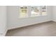 Bright and airy living room with large windows and wood-look flooring at 1680 Abberly Pl, Graham, NC 27253