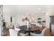 Dining area with a round table and chairs, open to kitchen and living room at 171 Calebs Corner Pl, Spring Lake, NC 28390
