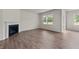 Living room with fireplace and hardwood flooring at 2508 Trevana Way, Graham, NC 27253