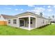 Covered patio off of the back of the house, overlooking the backyard at 2508 Trevana Way, Graham, NC 27253