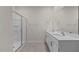 Modern bathroom with double vanity, frameless shower, and stylish tile at 2508 Trevana Way, Graham, NC 27253