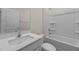 Bathroom with white vanity, tub, and shower at 2508 Trevana Way, Graham, NC 27253