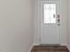 Front entry with white door and glass accents at 2508 Trevana Way, Graham, NC 27253