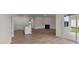 Open living room with hardwood floors and fireplace at 2508 Trevana Way, Graham, NC 27253