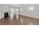 Bright living room with hardwood floors and a fireplace at 302 Sailfish Ct, Durham, NC 27703