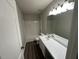 Bathroom with a white vanity, double sinks, and a tub shower combo at 305 Pebblestone Dr, Durham, NC 27703