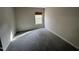 Bedroom with gray carpeting and a window with blinds at 305 Pebblestone Dr, Durham, NC 27703