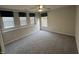 Bedroom with gray carpeting, window with blinds, and ceiling fan at 305 Pebblestone Dr, Durham, NC 27703