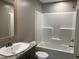 Clean bathroom with a shower/tub combo and a vanity at 332 Mill Creek Church Rd, Newton Grove, NC 28366