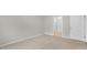Spacious bedroom with neutral carpeting and large window at 425 Ashley Run, Sanford, NC 27330