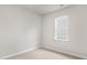 Bright bedroom featuring a window with blinds at 425 Ashley Run, Sanford, NC 27330