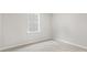 Small bedroom with window and neutral wall colors at 425 Ashley Run, Sanford, NC 27330