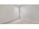 Small bedroom with window and neutral wall colors at 425 Ashley Run, Sanford, NC 27330