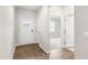 Bright and airy entryway with wood-look flooring and access to other rooms at 425 Ashley Run, Sanford, NC 27330