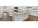 Modern kitchen with island and stainless steel appliances at 425 Ashley Run, Sanford, NC 27330