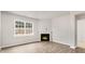 Living room with corner fireplace and wood-look flooring at 425 Ashley Run, Sanford, NC 27330