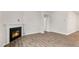 Living room showcasing a cozy corner fireplace at 425 Ashley Run, Sanford, NC 27330