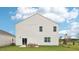 House exterior showcasing a patio and spacious backyard at 6433 Alfalfa Ln, Wake Forest, NC 27587