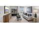 Upstairs bonus room with a couch and built in shelving at 6433 Alfalfa Ln, Wake Forest, NC 27587