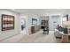 Spacious bonus room with a couch, media console, and adjacent bedroom at 6433 Alfalfa Ln, Wake Forest, NC 27587