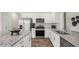 Modern kitchen featuring stainless steel appliances and granite countertops at 6433 Alfalfa Ln, Wake Forest, NC 27587