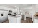 Open concept kitchen with island and stainless steel appliances at 6433 Alfalfa Ln, Wake Forest, NC 27587