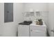 Convenient laundry room with washer, dryer, and shelving at 6433 Alfalfa Ln, Wake Forest, NC 27587