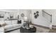 Open living area with sectional sofa and view of staircase at 6433 Alfalfa Ln, Wake Forest, NC 27587