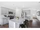 Modern kitchen featuring granite island, stainless steel appliances, and gray cabinets at 6437 Alfalfa Ln, Wake Forest, NC 27587