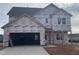 Two-story house with gray roof and attached garage, currently under construction at 105 Wilderness Ct, Mebane, NC 27302