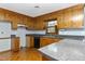 Kitchen with wood cabinets, granite counters and flooring at 132 Rollingwood Dr, Dunn, NC 28334