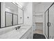 Modern bathroom with a white quartz countertop, black matte fixtures, and a walk-in shower at 2637 Trifle Ln, Wake Forest, NC 27587