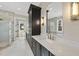Elegant bathroom with marble countertops, dark cabinetry and a large mirror at 2637 Trifle Ln, Wake Forest, NC 27587