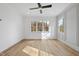 Bright bedroom with hardwood floors, multiple windows and a ceiling fan at 2637 Trifle Ln, Wake Forest, NC 27587