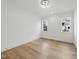 Spacious bedroom with hardwood floors and two windows at 2637 Trifle Ln, Wake Forest, NC 27587