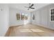 Light-filled bedroom with hardwood floors and large windows offering natural light at 2637 Trifle Ln, Wake Forest, NC 27587