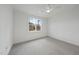 Spacious bedroom with carpeted floor, ceiling fan and window with wooded view at 2637 Trifle Ln, Wake Forest, NC 27587