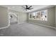 Spacious bedroom with carpeted floor, large windows, and ceiling fan at 2637 Trifle Ln, Wake Forest, NC 27587