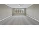 Bright bedroom featuring grey walls, a ceiling fan, and ample natural light at 2637 Trifle Ln, Wake Forest, NC 27587