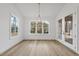Bright breakfast nook with hardwood floors and access to backyard at 2637 Trifle Ln, Wake Forest, NC 27587