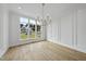 Spacious dining room with hardwood floors and large windows at 2637 Trifle Ln, Wake Forest, NC 27587