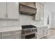 Modern kitchen with stainless steel appliances and white backsplash at 2637 Trifle Ln, Wake Forest, NC 27587