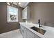 Modern laundry room with stainless steel sink and shaker cabinets at 2637 Trifle Ln, Wake Forest, NC 27587