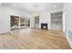Spacious living area with hardwood floors, fireplace, built-in shelving and access to a back patio at 2637 Trifle Ln, Wake Forest, NC 27587
