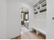 Bright mudroom with built-in bench and open shelving at 2637 Trifle Ln, Wake Forest, NC 27587