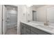 Double vanity bathroom with grey cabinets and a shower/tub combo at 276 Umstead St, Sanford, NC 27330