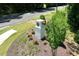 Community entrance sign with brick pillars and wood at 276 Umstead St, Sanford, NC 27330