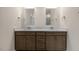 Double vanity bathroom with dark brown cabinets and a light gray countertop at 280 Umstead St, Sanford, NC 27330
